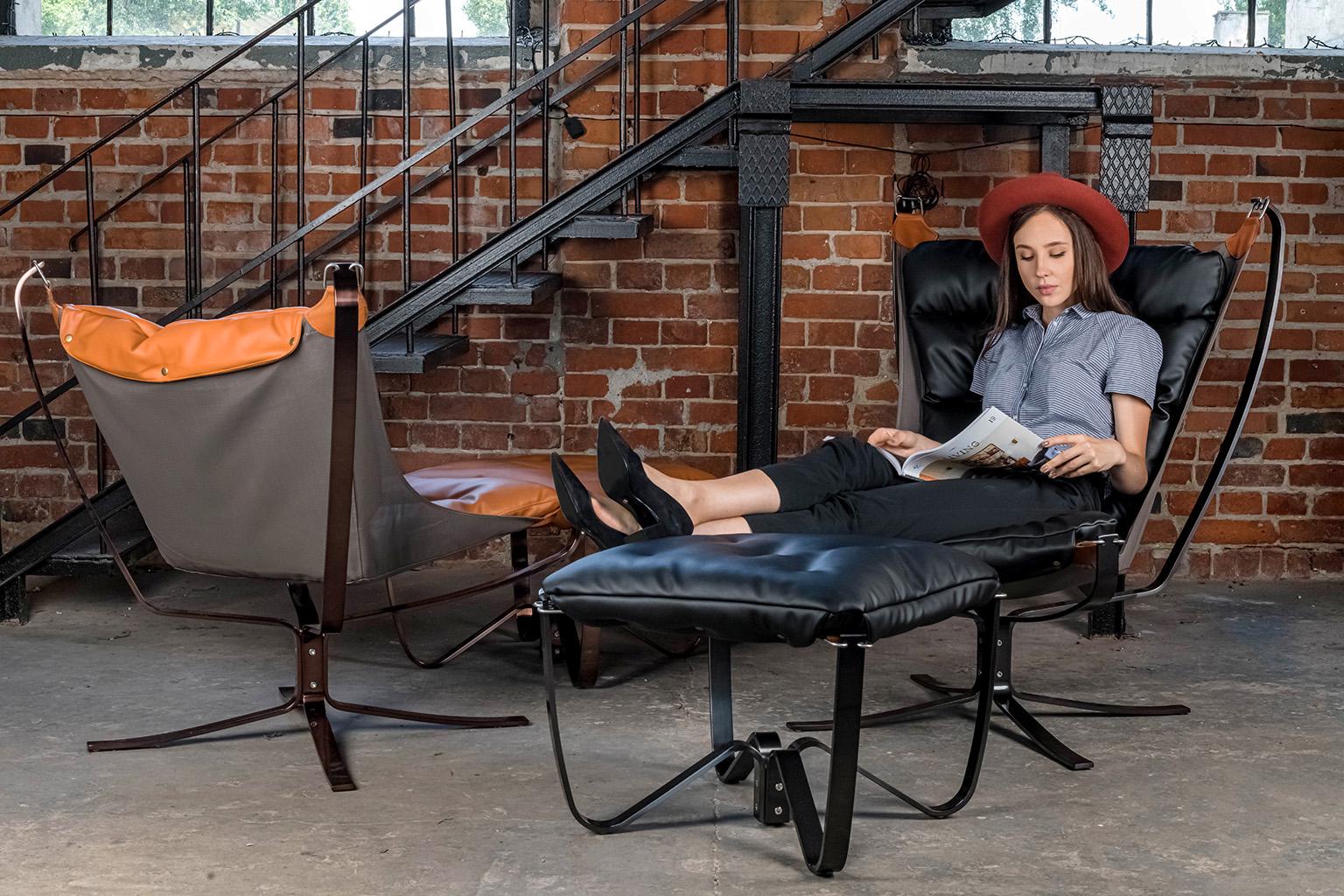 Photo of ARNI HIGH armchair with footrest in an industrial interior 2