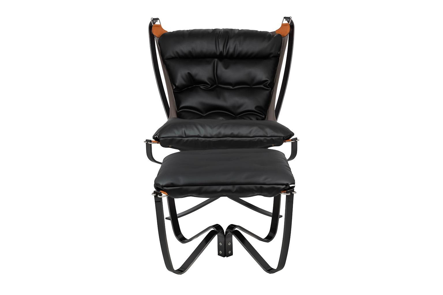 Photo of ARNI HIGH armchair with footrest from the front